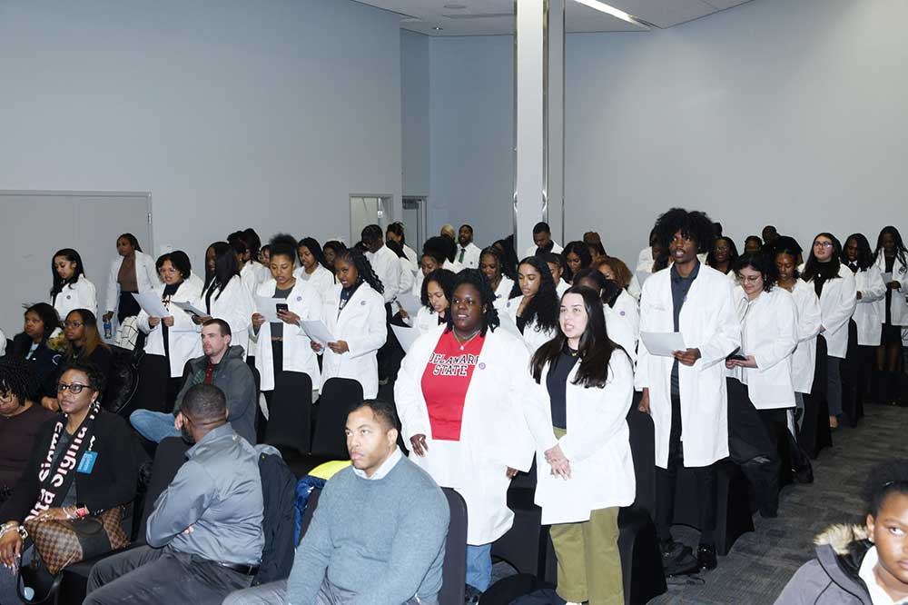 The DSU Pre-health majors who received white coats during the ceremony recite an oath that reflects their commitment to successfully complete their academic discipline and become a health professional.