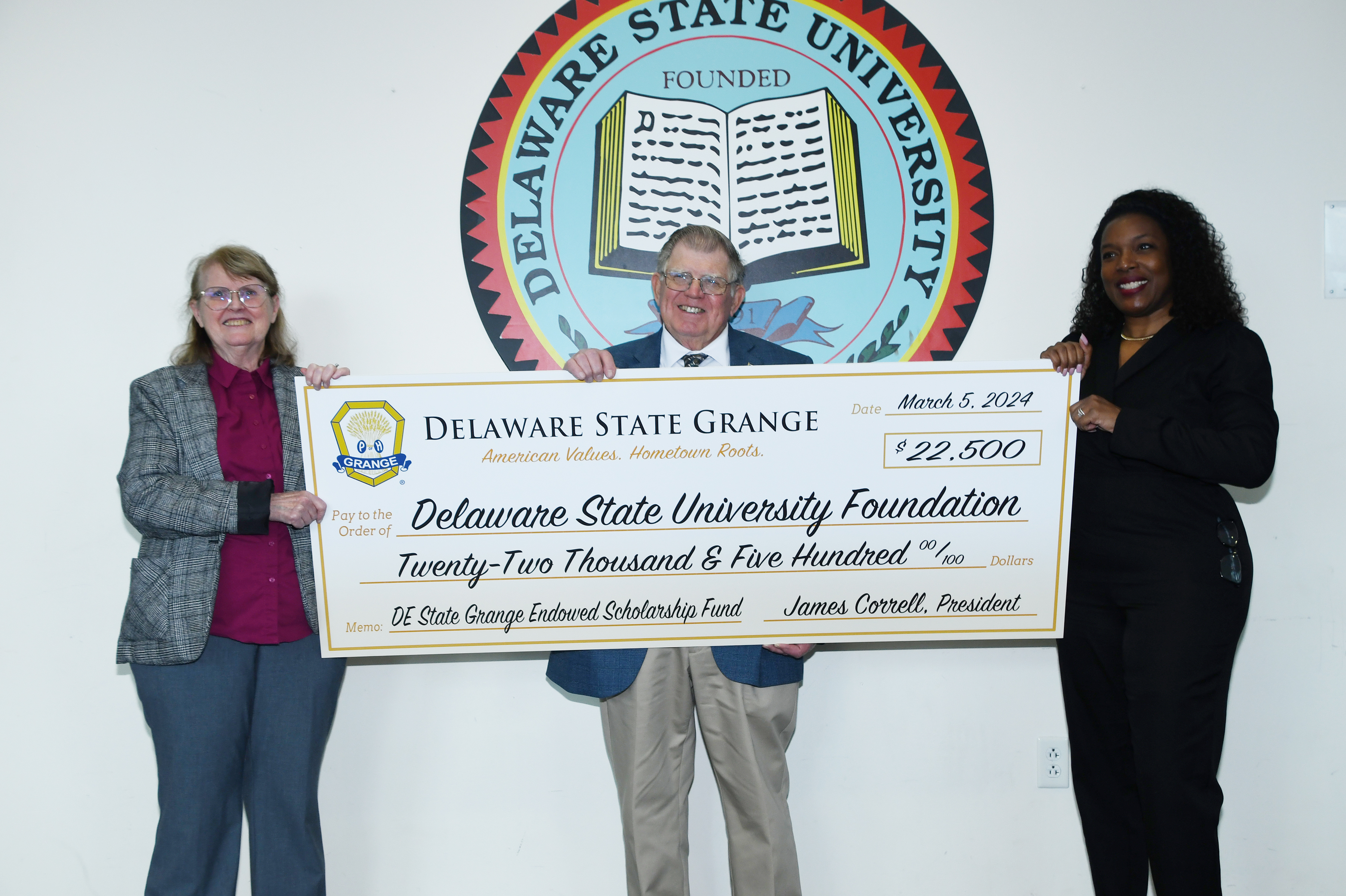 Delaware State Grange representatives Debbie Edwards (secretary) and Jimmy Correll (president) present a symbolic check representing their newly established endowment to Dean Cherese Winstead Casson of the DSU College of Agriculture, Science and Technology.