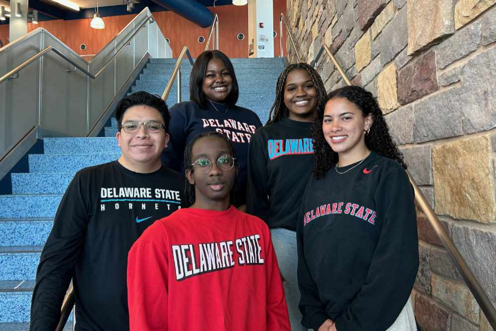 "The Innovative Hornets" case study team -- (l-r) Lorenzo Perales, Carl Jennings (red shirt), Imani Wulff-Cochrane, Nya Stokes, and Ava Larkin -- made it to the finalist round of the Goldman-Sachs Market Madness: HBCU Possibilities competition, Each student won a $10,000 scholarship; the team also won $250,000 for Delaware State University.