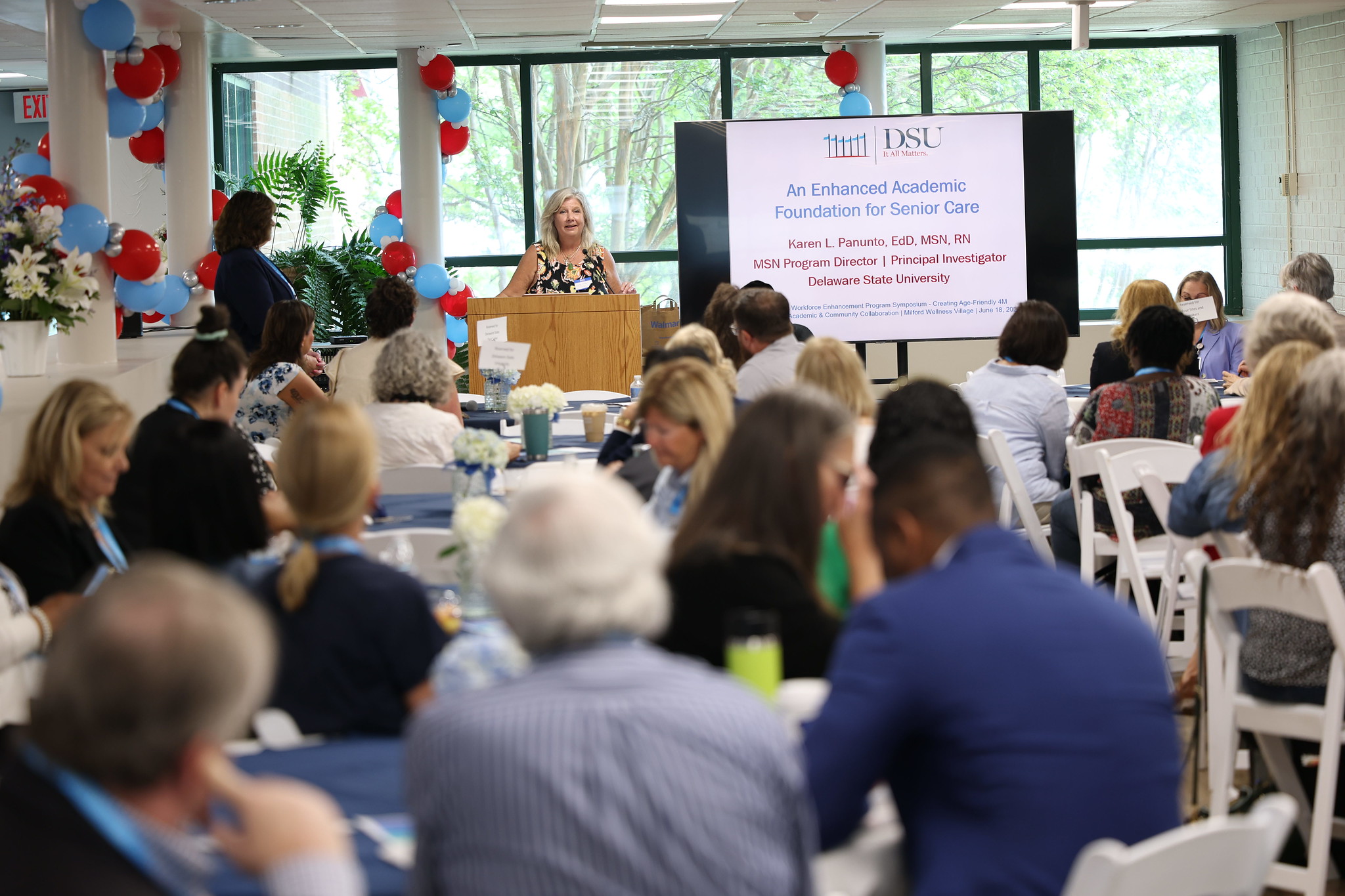 Attendees listen to a presentation during the inaugural GWEP Symposium at the Milford Wellness Village on June 18.