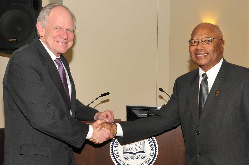 Gov. Michael N. Castle is shown shaking hands with then-DSU Board Chairman Claibourne Smith in 2012 when he was sworn in as a University Board of Trustees member. Gov. Castle served two six-year terms on the Board.