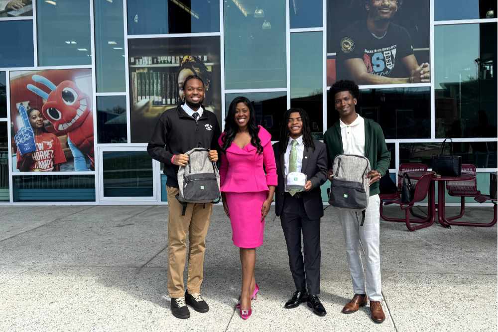 From left, DSU student Chaasahn Hughes, JoAnn Means of TD Bank, and DSU students Elijah Taylor and Tymere Thomas outside the Martin Luther King Jr. Student Center.