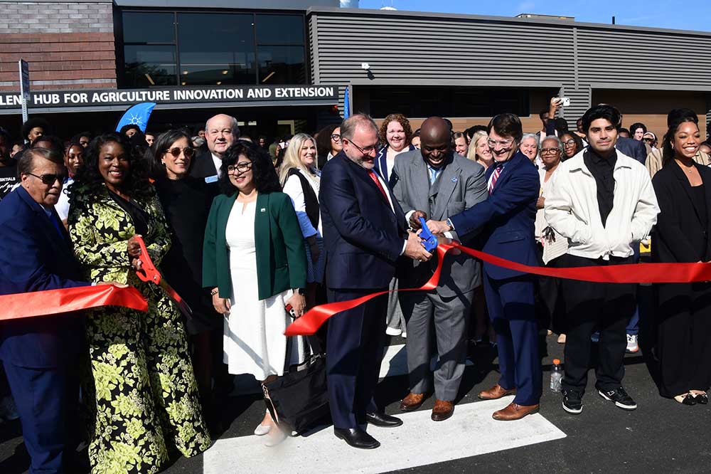 CAST Dean Cherese Winstead and DSU President Tony Allen are joined by Agilent, state and local officials in cutting the ribbon for the opening of the Agilent Hub for Agriculture, Innovation, and Technology building.