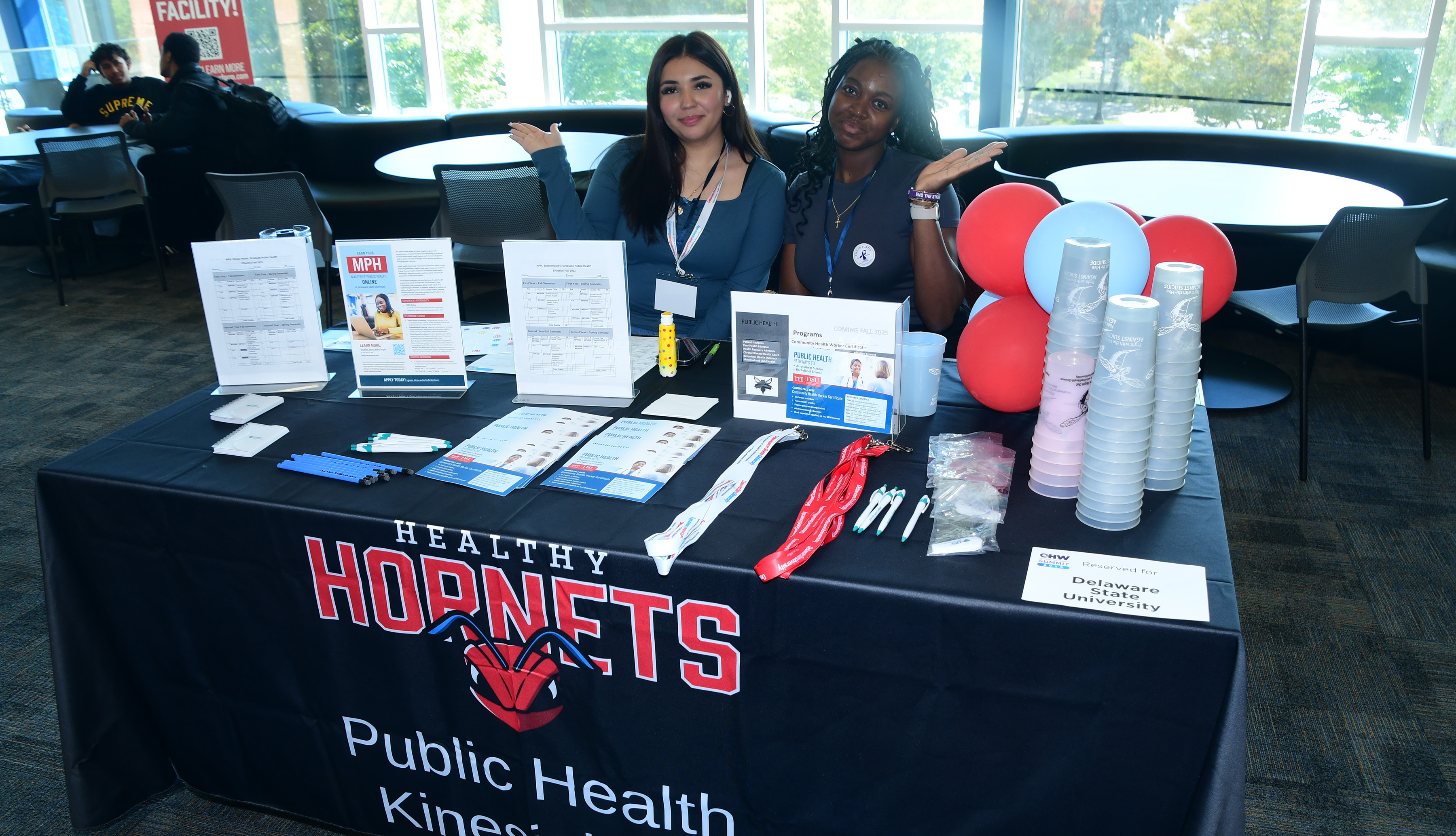(L-r) Esthefani Aguilar and Chidubem "Miriam" Okwudibonye man the Healthy Hornet -- Public Health Kinesiology table at the Community Health Worker Summit held Oct. 15 in the MLK Jr. Student Center.