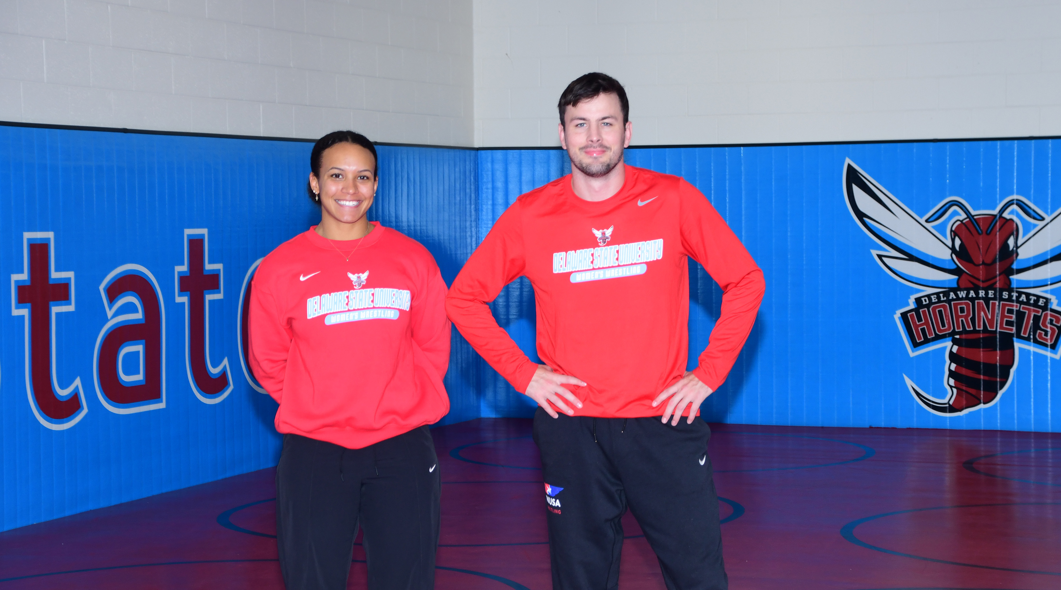 (L-r) DSU Women's Wrestling Head Coach Kenya "Chris" Sloan and Assistant Coach Brock Budesheim were traveling back with 13 student athletes and an athletic trainer from the team's first-ever competition in Pa., when they stopped on I-95 to help a woman in a disabled vehicle get out of her car on the dangerous highway, possibly saving her life.