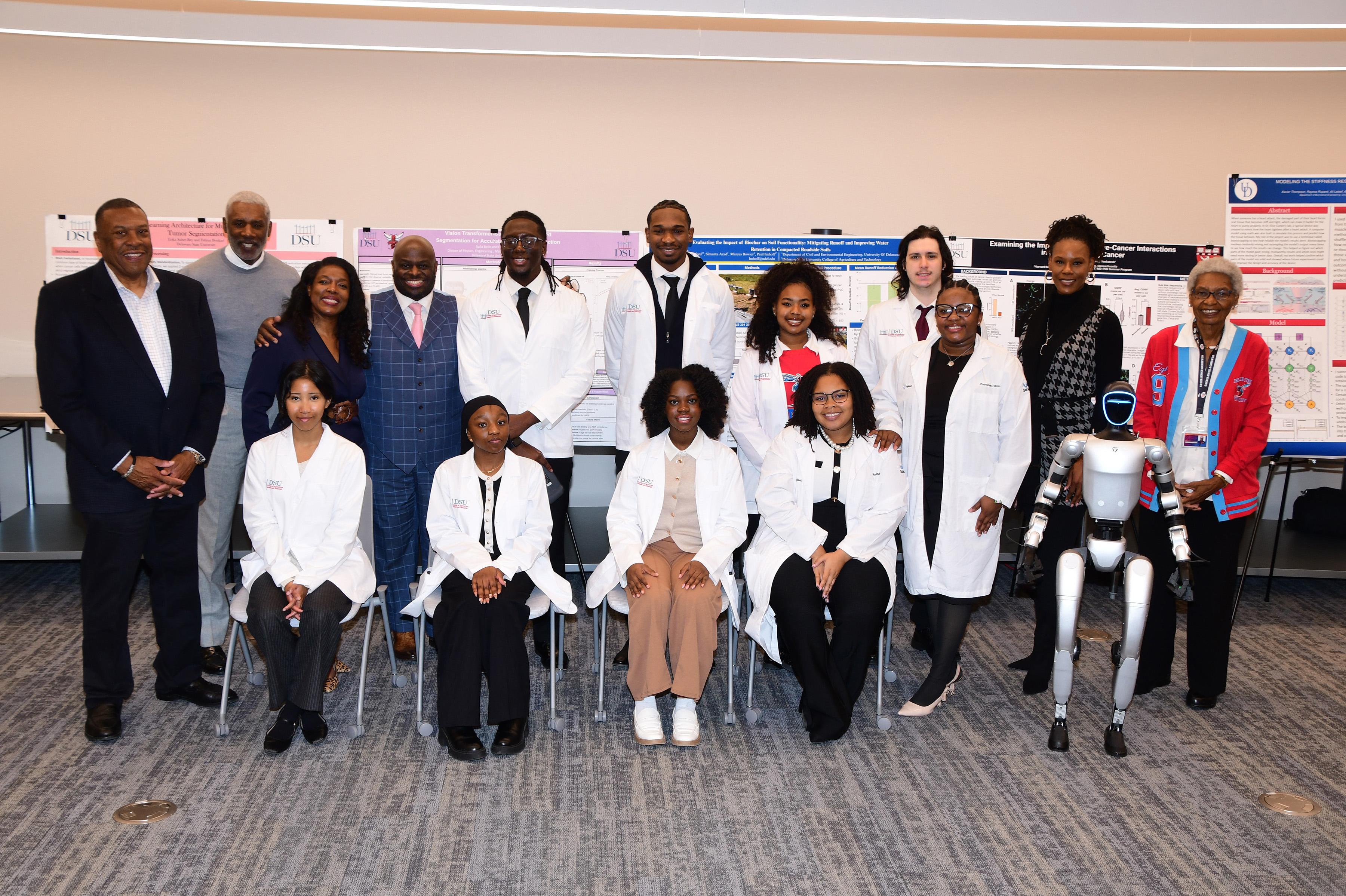 Student researchers from the College of Agriculture, Science, and Technology pose for a group shot with some of the Board of Trustees members during the governing body's December Retreat.