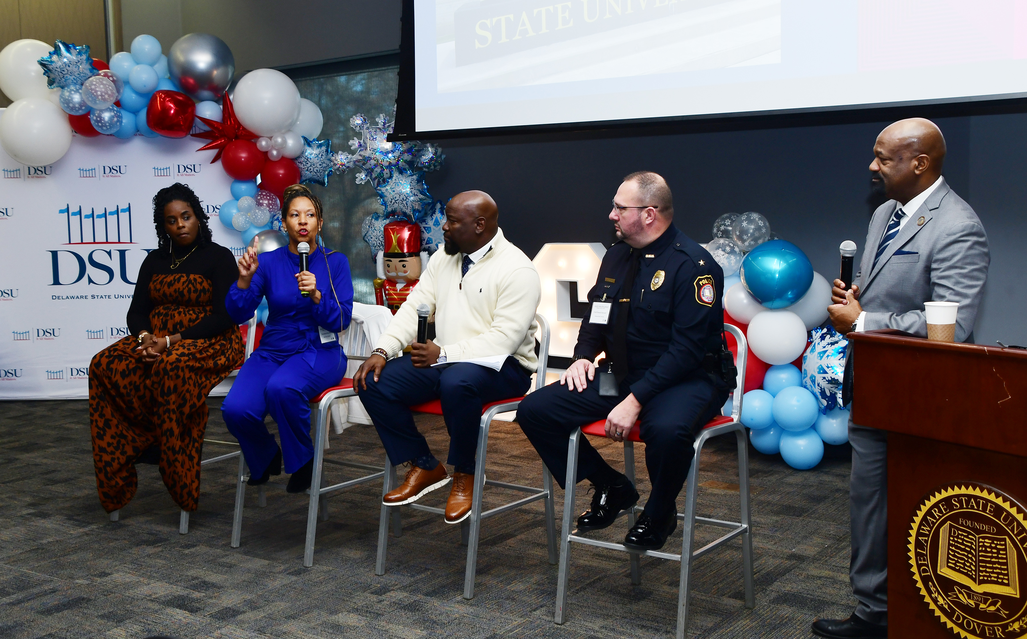 The Student Affairs Conference at DSU that focused on homecoming issues included a panel discussion with (l-r) Sarah Gaines of Chicago State University, Thomasina Boardley from Bowie State University, Norfolk State University Police Chief Brian Covington, and DSU Police Chief Donald Baynard, as well as James Overton, Vice President of Student Affairs and DSU Police Superintendent, who facilitated the "Town Hall" discussion.
