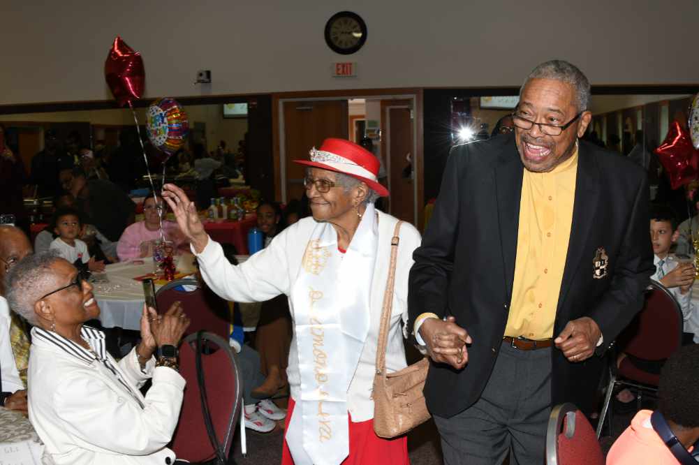Susan Young Browne, DSU's oldest living alumna, makes her entrance to her 108th birthday celebration escorted by her son James Young II at the May 2 celebration event held at Whatcoat United Methodist Church of Dover. Mrs. Browne graduate from the then-State College for Colored Students in 1945 with a bachelor's degree in Elementary Education, leading to a 30-year teaching career.