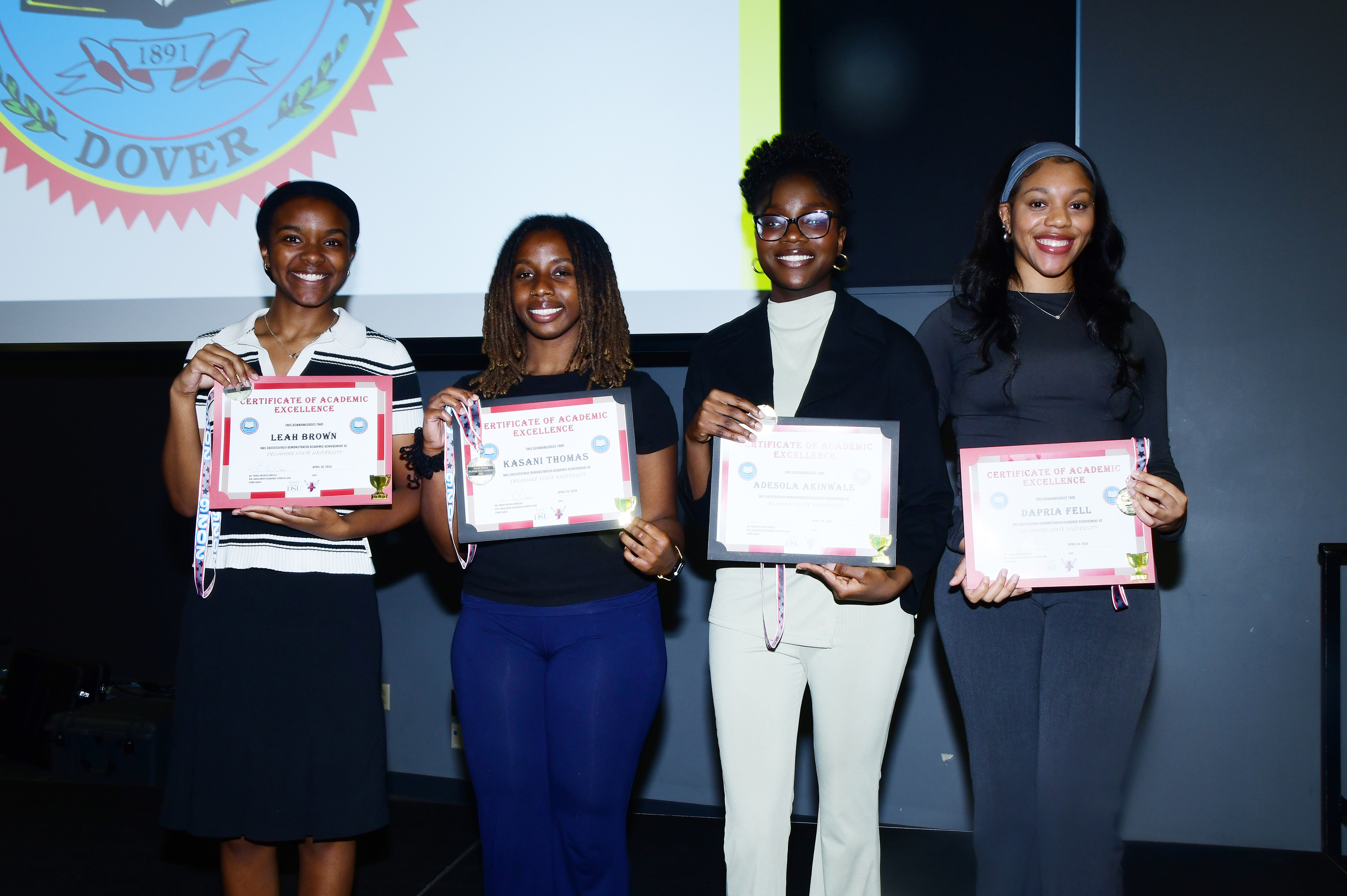 These senior Presidential Scholars -- (l-r) Leah Brown, Kasani Thomas, Adesola Akinwale, and Dapria Fell -- were recognized for their academic excellence during a joint Strategic Enrollment Management and Veterans Affairs ceremony on May 11 in the Martin Luther King Jr. Student Center.
