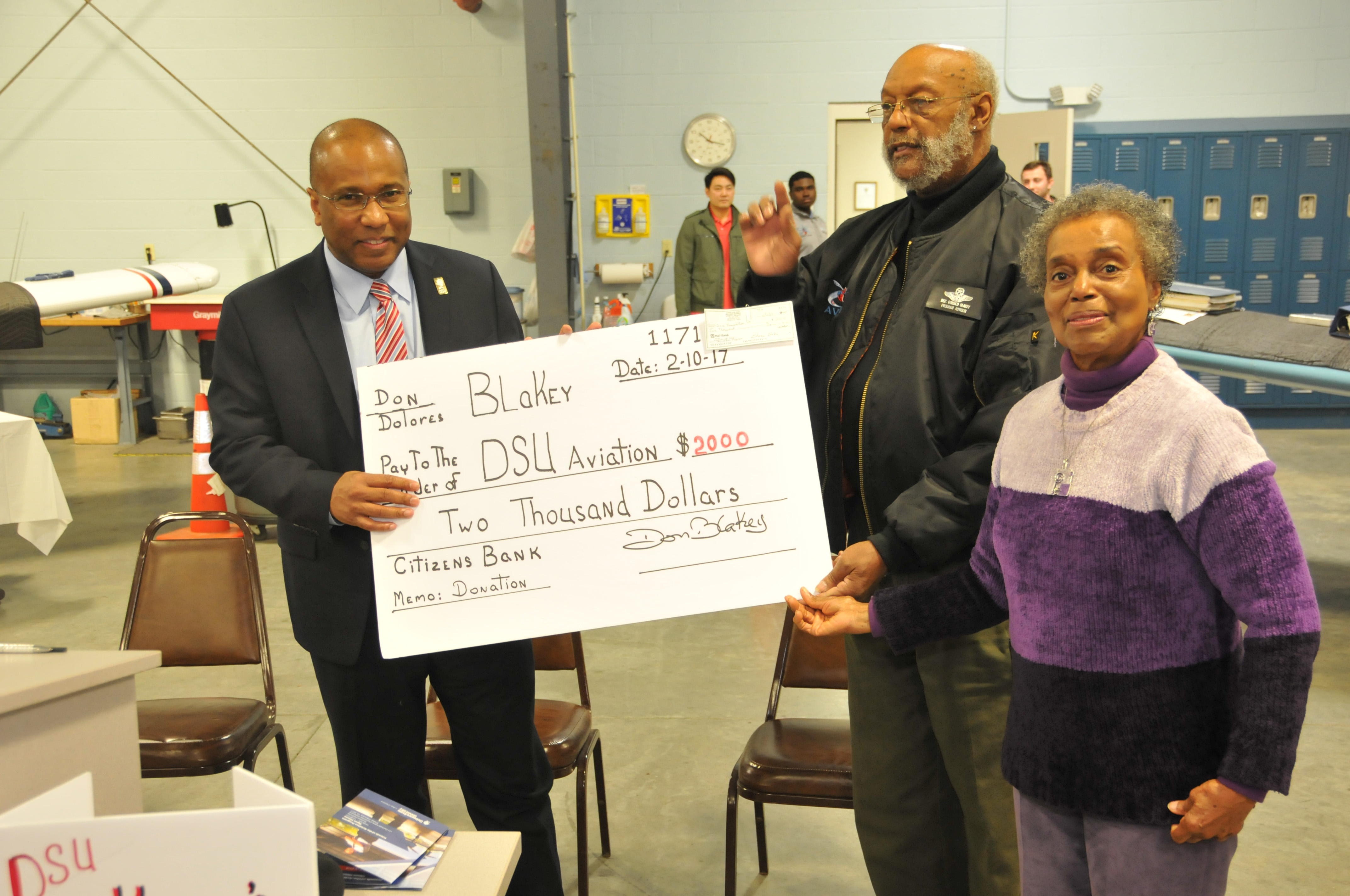 DSU President Harry L. Williams accept a check from Dr. Donald Blakey and his wife Dolores as a kick-off contribution for the newly launched Friends of the DSU Aviation Program fundraising campaign.