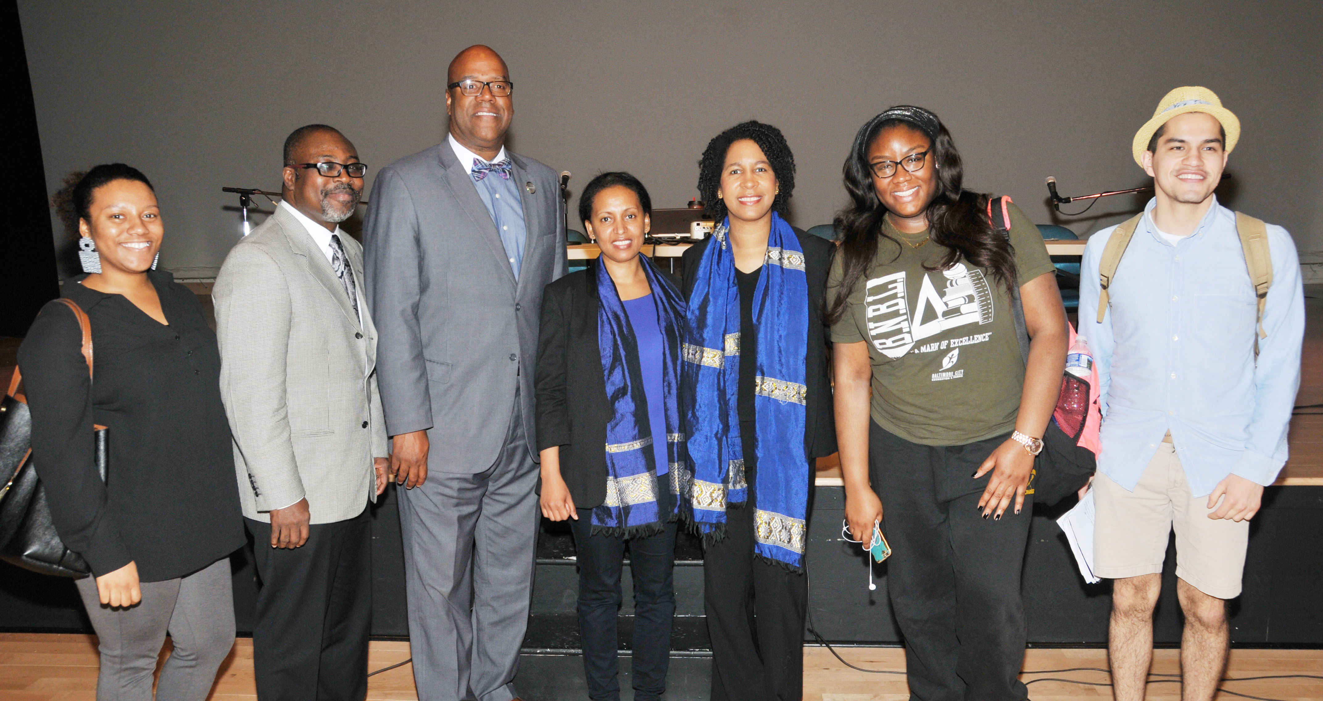 Honor Africa Forum panelists share a photo opp with a few students