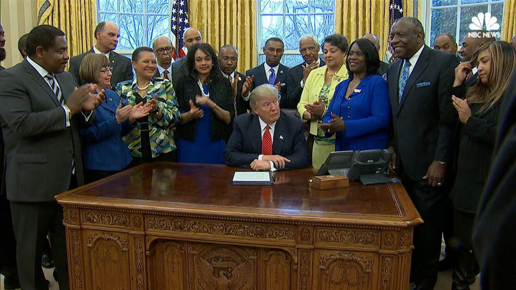 DSU President Harry Williams, standing behind President Trump, joins other HBCU presidents for the Executive Order signing. To the right of Trump in yellow outfit is Dr. Cynthia Jackson-Hammond, former DSU chair, now president of Central St. Univ.