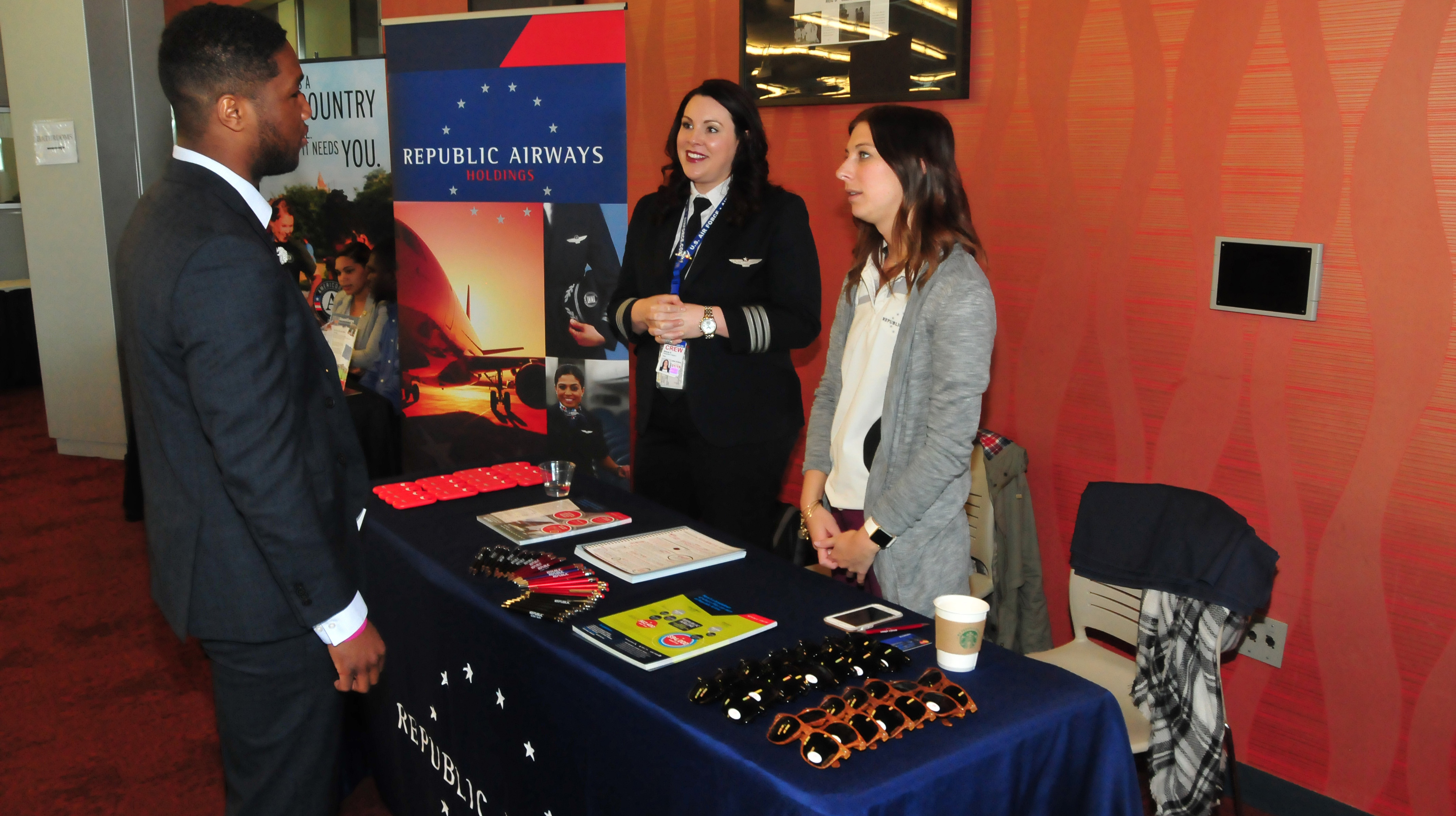 A DSU student get some job information from Republic Airways Holdings during the DSU Career Services Career Fair.