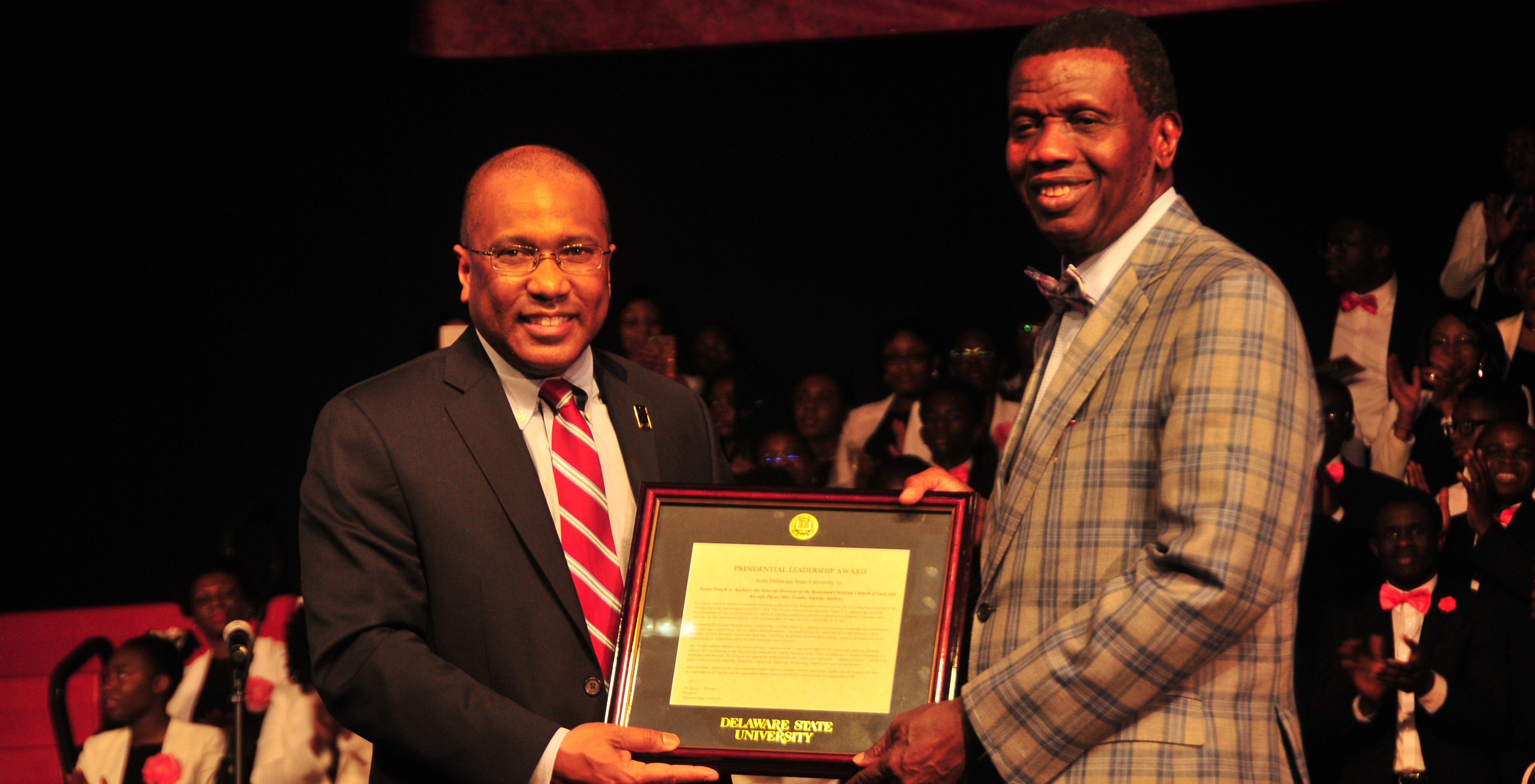 DSU President Harry L. Williams presents Enoch A. Adeboye, worldwide general overseer of the Redeemed Christian Church of God, with the President's Leadership Award during the denomination's Holy Ghost Festival of LIfe held at DSU on Feb. 24.