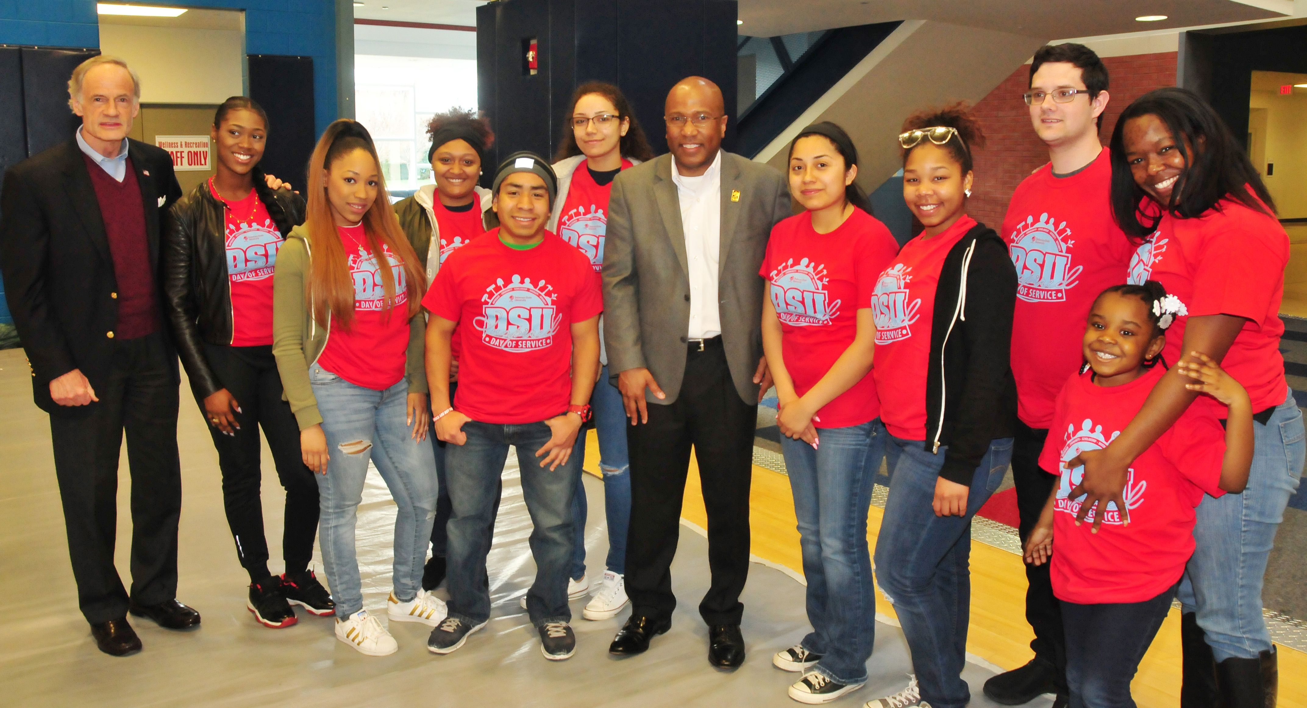 U.S. Sen. Tom Carper (far left) and DSU President Harry L. Williams (center) pose with a few of the more than 300 students who took part in the April 1 Inspired Day of Service.