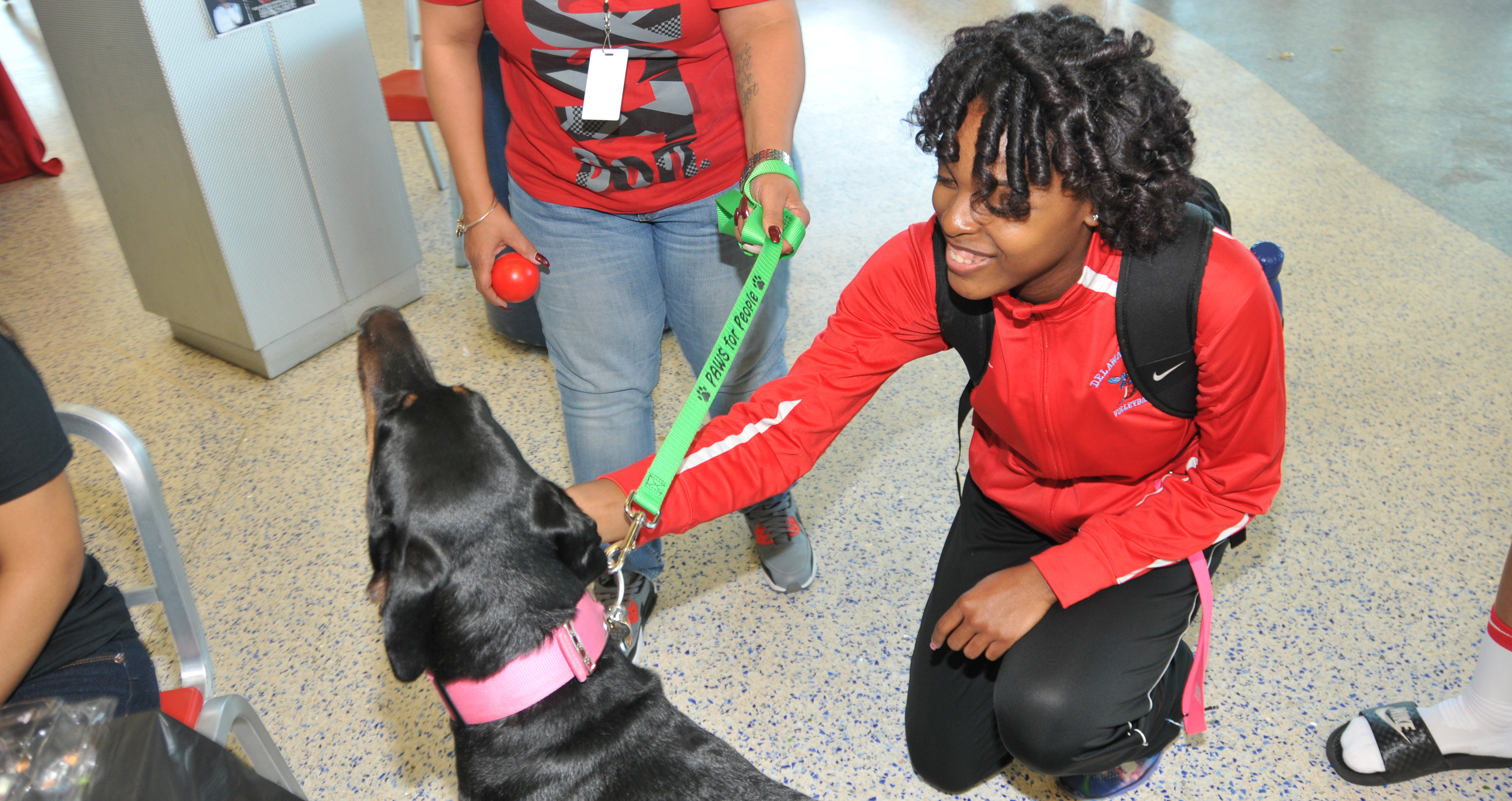 A DSU student learns how pet therapy can reduce stress and anxiety. Such information was shared as part of the National Public Health Week activities in the MLK Jr. Student Center on April 5.