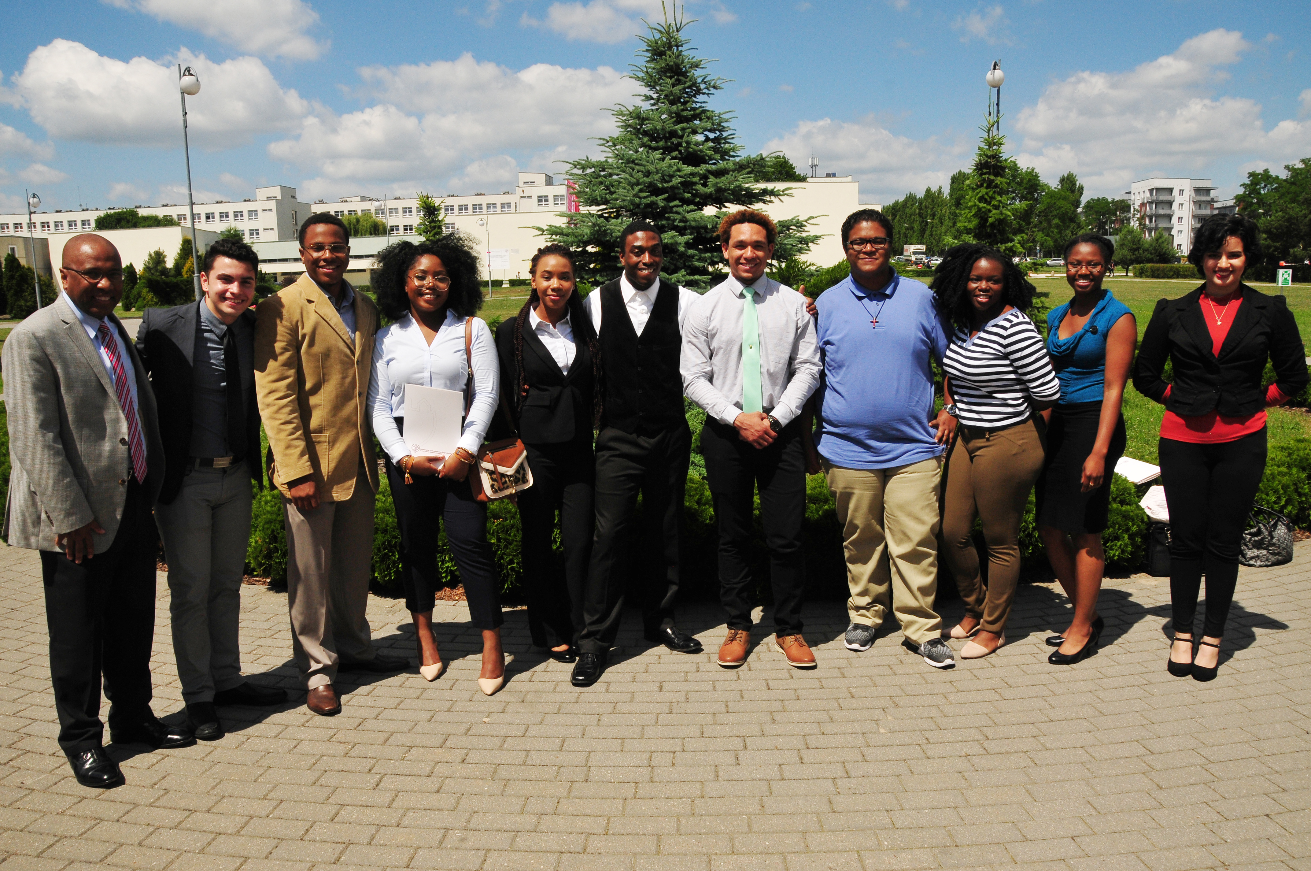 DSU President Harry L. Williams poses with the I-STARS students in Poland