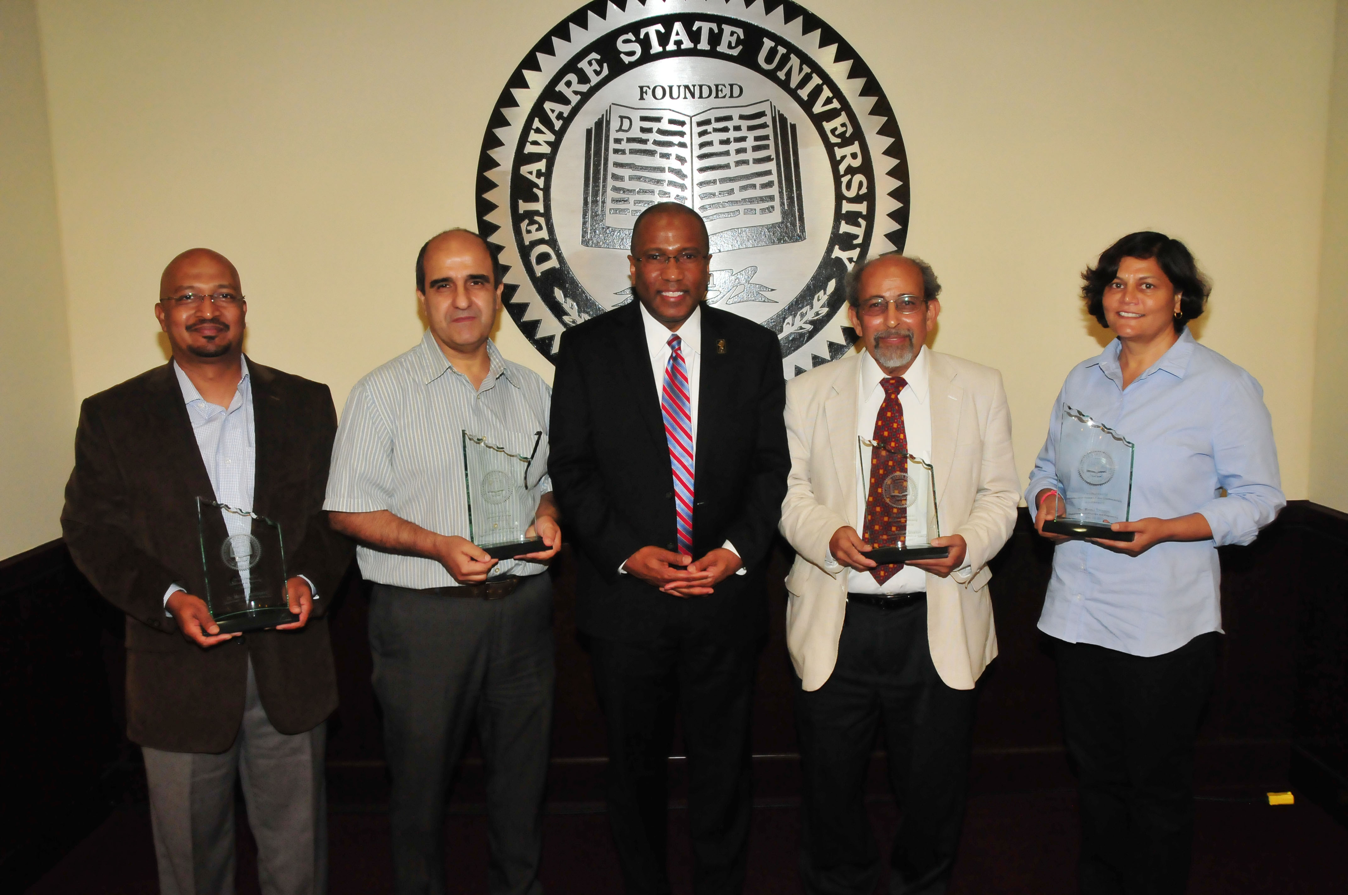 The  2017 DSU Faculty Excellence Awardees: (l-r) Dr. Murali Temburni (Teaching), Dr. Hacene Boukari (Service), DSU President Harry L. Williams, Dr. Mazin Shahin (Advising), and Dr. Renu Tripathi (Research).