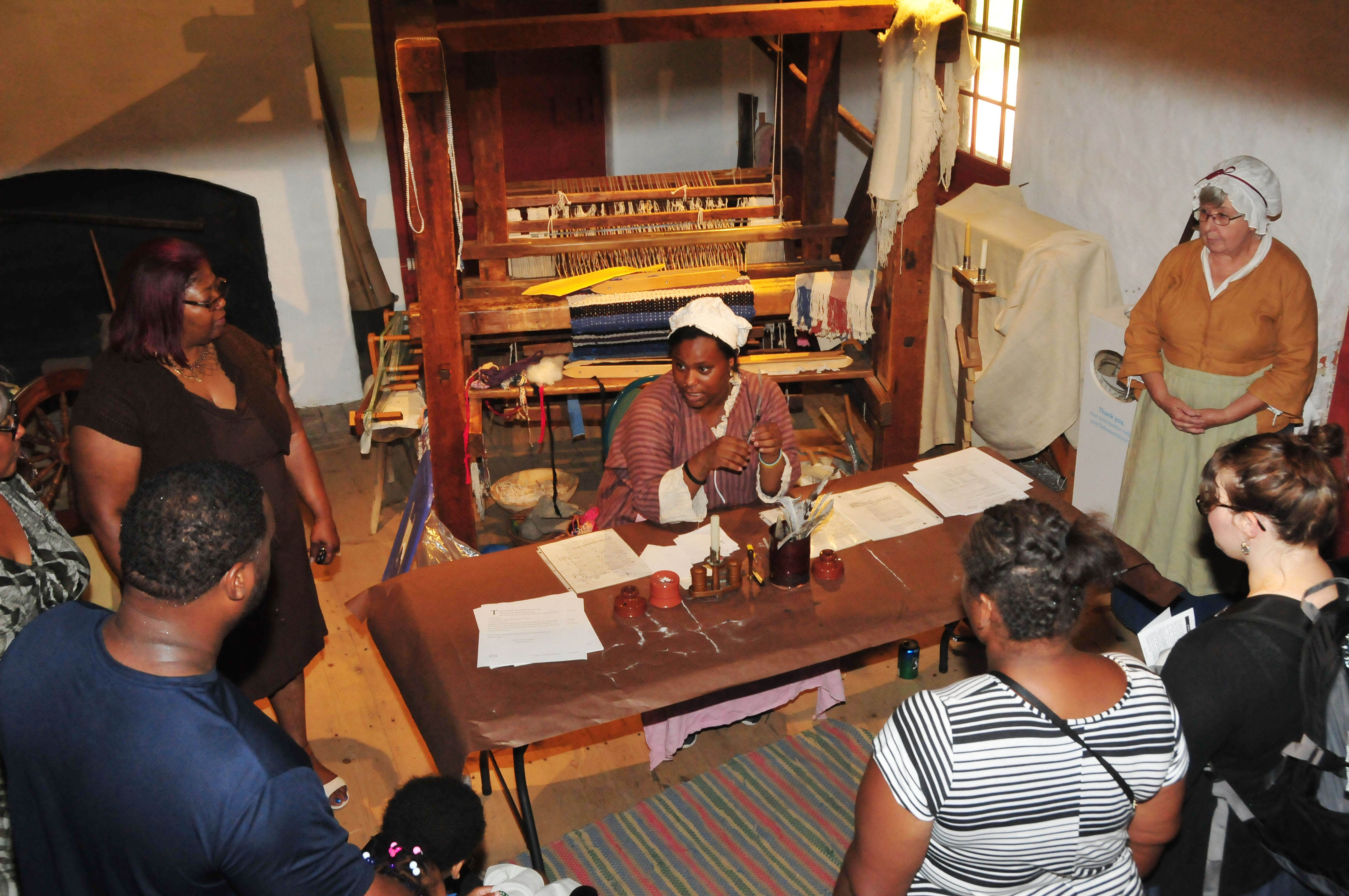 Armani McCoy explains the use of the quail pen during the 1700s to visitors at the John Dickinson Plantation. 