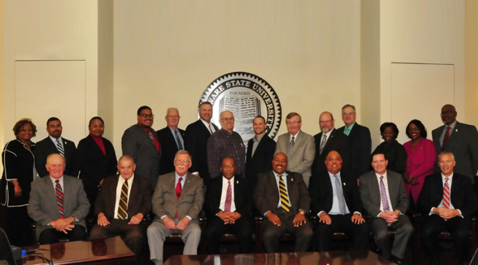 Kent County legislators participate in a photo opp moment with DSU Harry L. Williams, Board of Trustees Chairman David Turner and Vice Chairman Barry Granger along with other University officials.