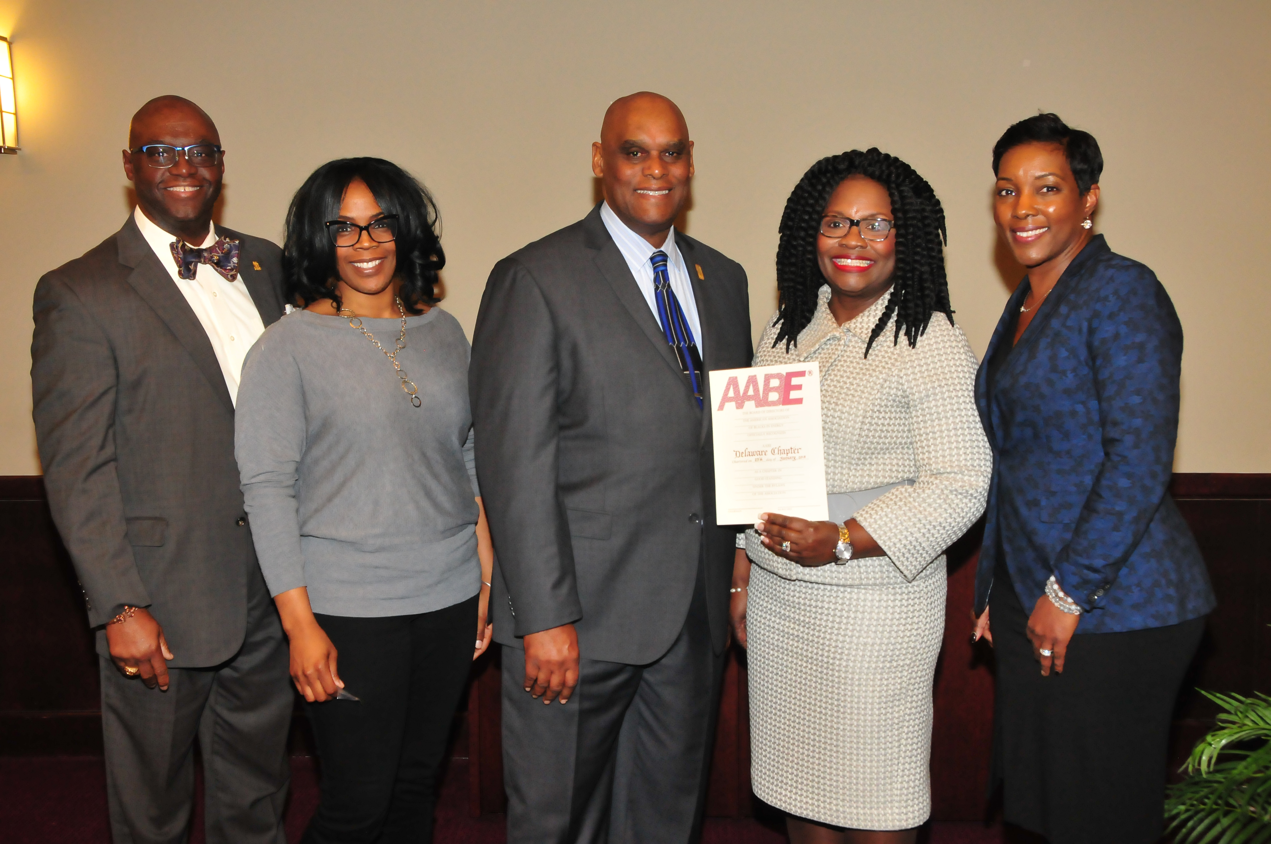 John Allen of Delmarva Power, along with Amber Young, William Pickrum, Enid Wallace-Simms, secretary, vice president and president, respectively; along with Paula Glover, national AABE president/CEO, celebrate the new Delaware AABE Chapter. 