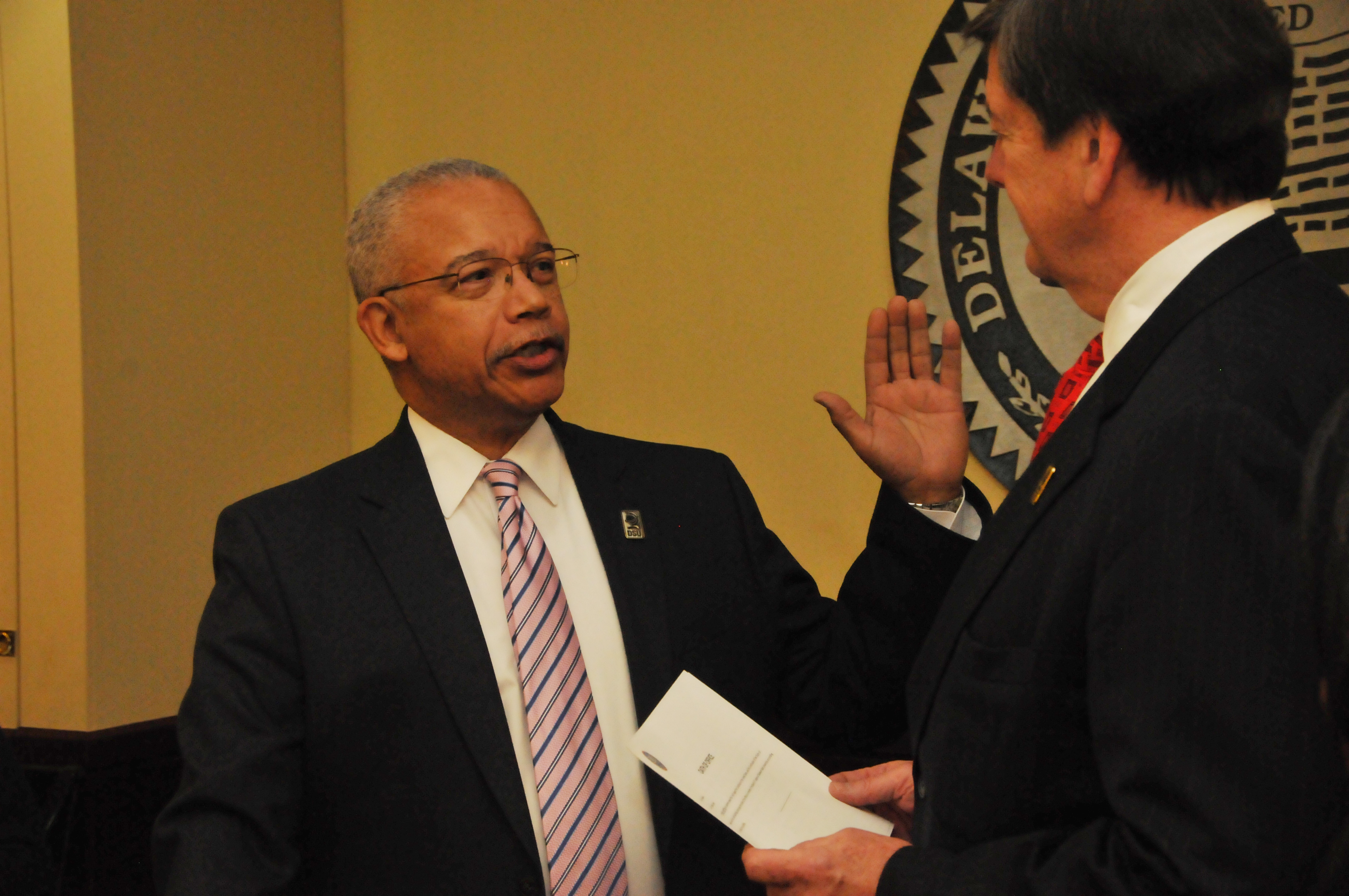 Norman D. Griffiths is sworn in as a new trustee by Tom Preston, interim general counsel, during the DSU Board of Trustees' Jan. 30 public meeting.