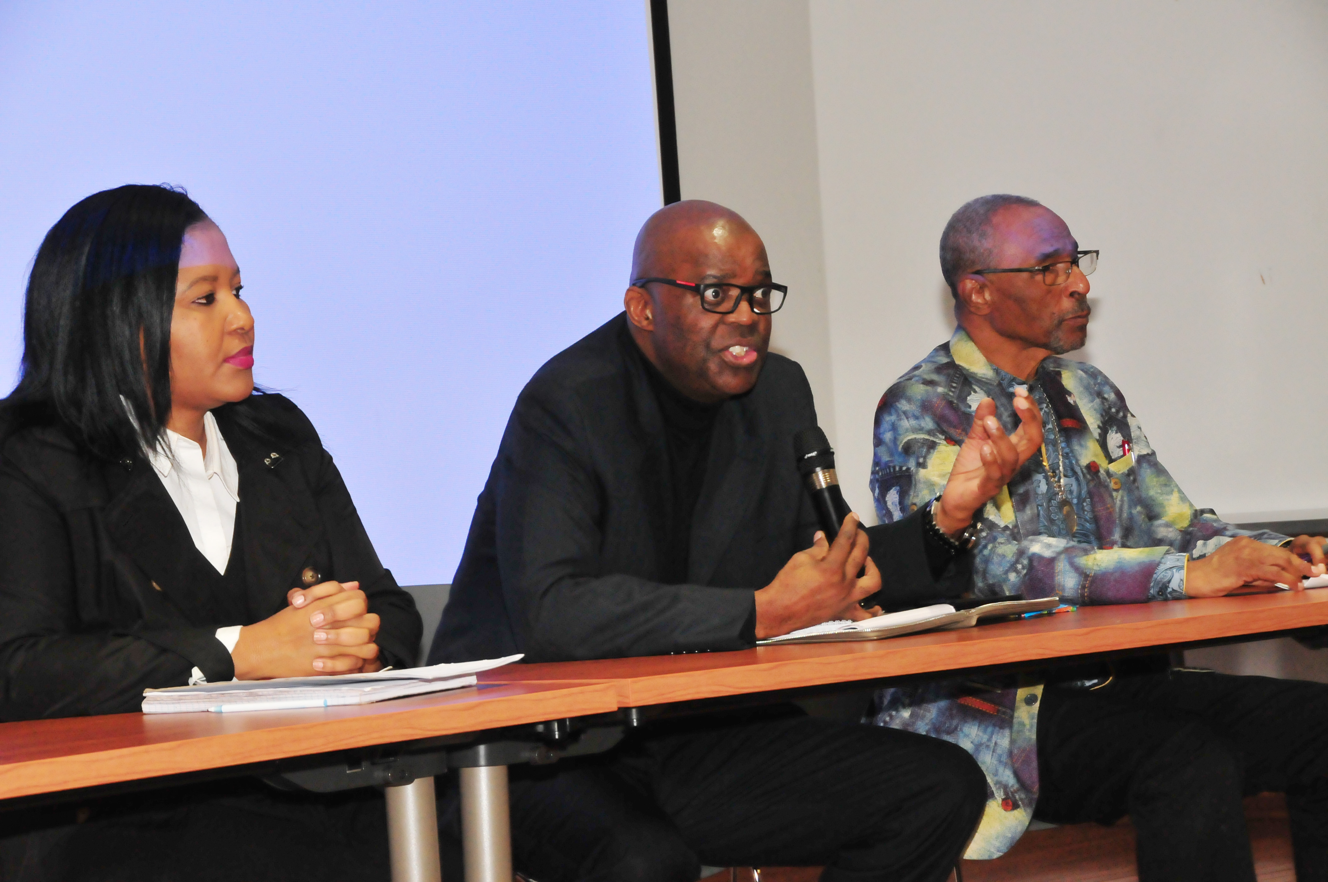 Dr. Eddy Maloka (center), CEO of the African Peer Review Mechanism, fields a question from the audience of DSU students. He is flanked by Tumi Dlamini (l), Dr. Maloka's advisor, and C. Gregory Turner, of Kool-Baker Global, a firm that invests in businesses in Africa.