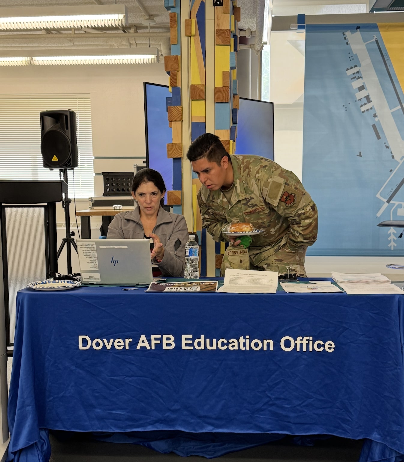 A servicemember meets with a Dover AFB Education Office representative during the Fall 2025 Open House.